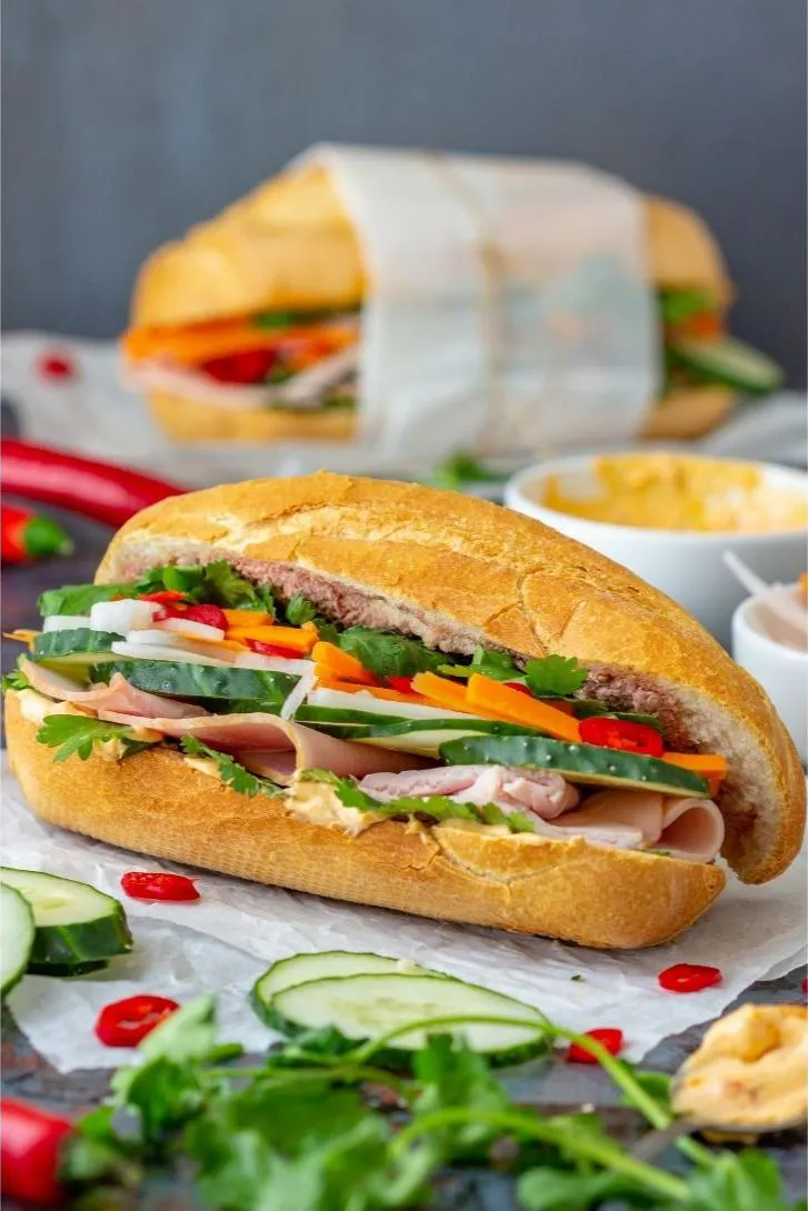 Classic Vietnamese banh mi sandwich filled with ham, cucumber, herbs and pickled veggies at Pho Kitchen, a Vietnamese Restaurant in San Jose